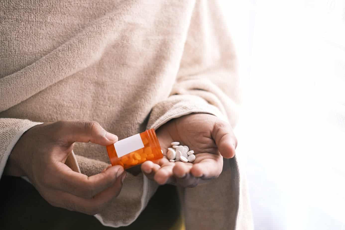 person holding opioids prescription painkiller