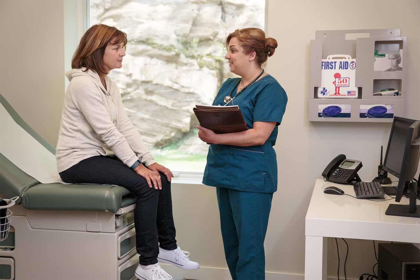 Nurse Discussing Needs With Patient