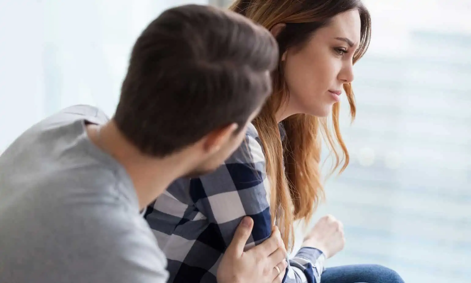 Man and woman having a deep discussion about communication in recovery