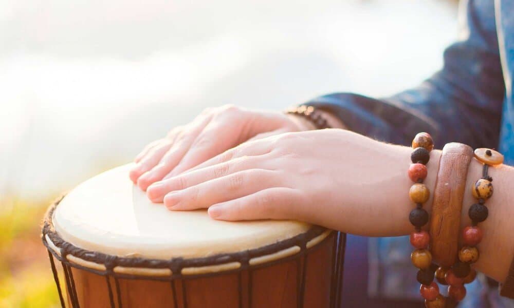Close up of two hands on a drum