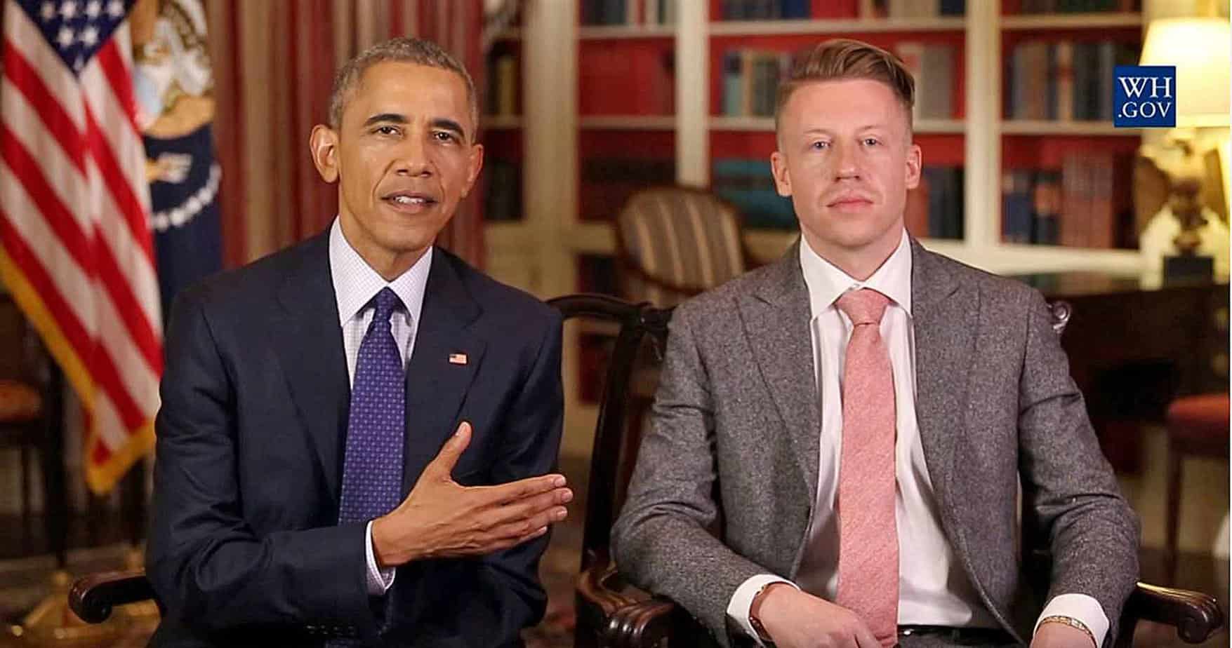 Macklemore and president obama sitting next to each other in white house oval office