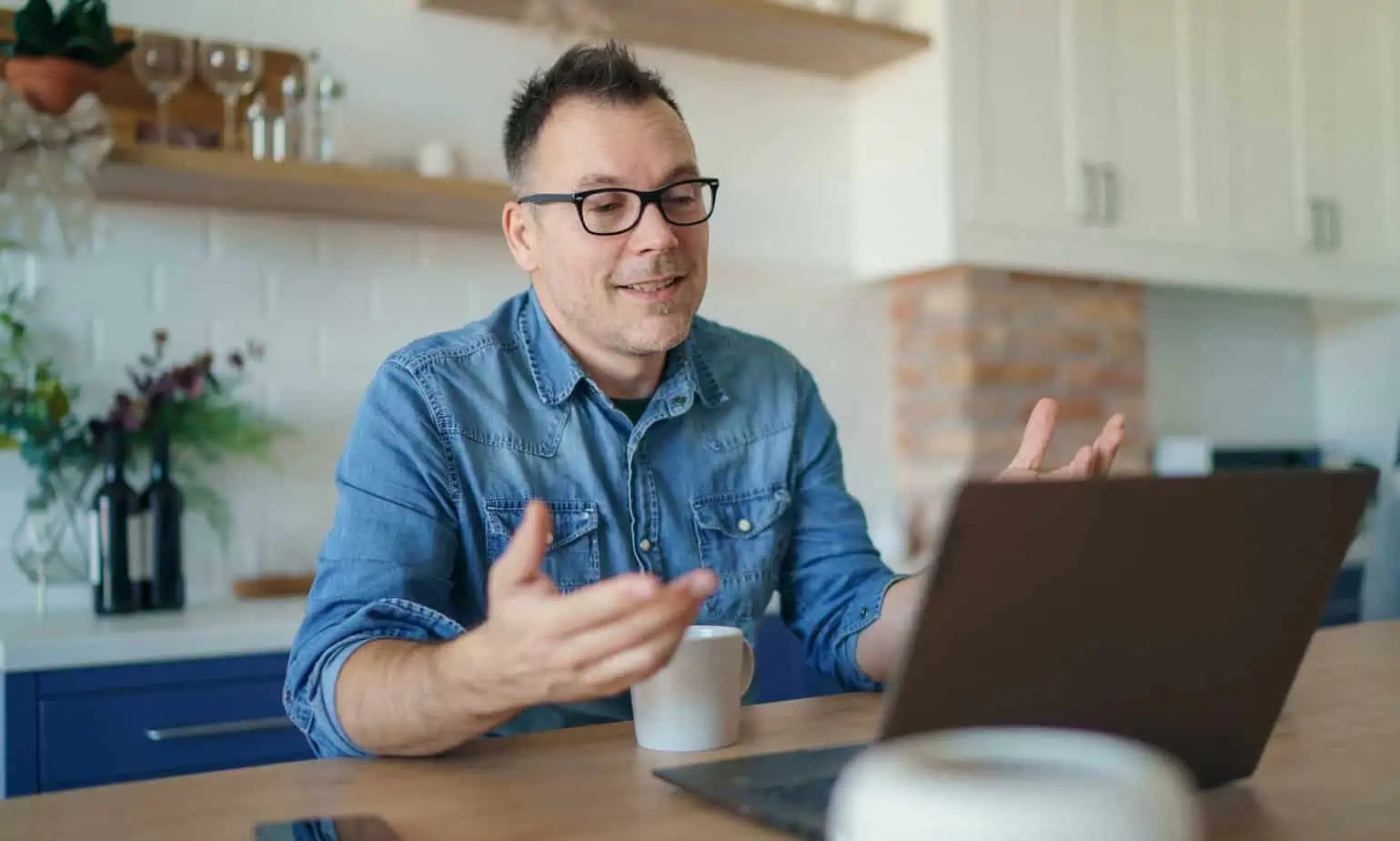 Client is engaged in a virtual counseling session via laptop