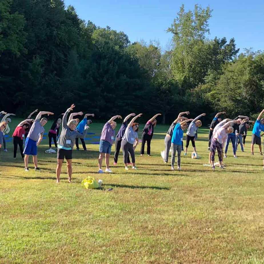 Yoga stretch at Mountainside Treatment Center Canaan Alumni Retreat Event 2018