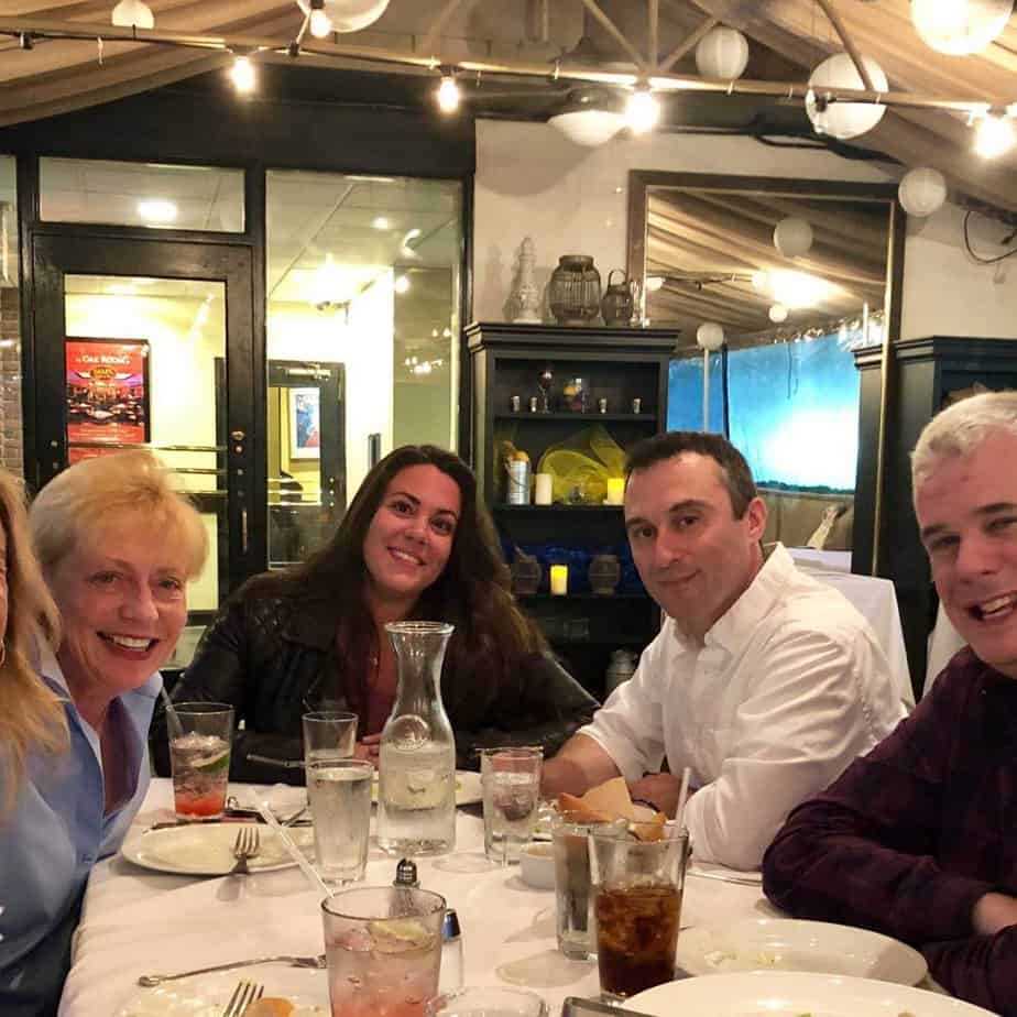 Group of friends around a table at Mountainside Treatment Center Alumni Dinner and Roundtable April 2019
