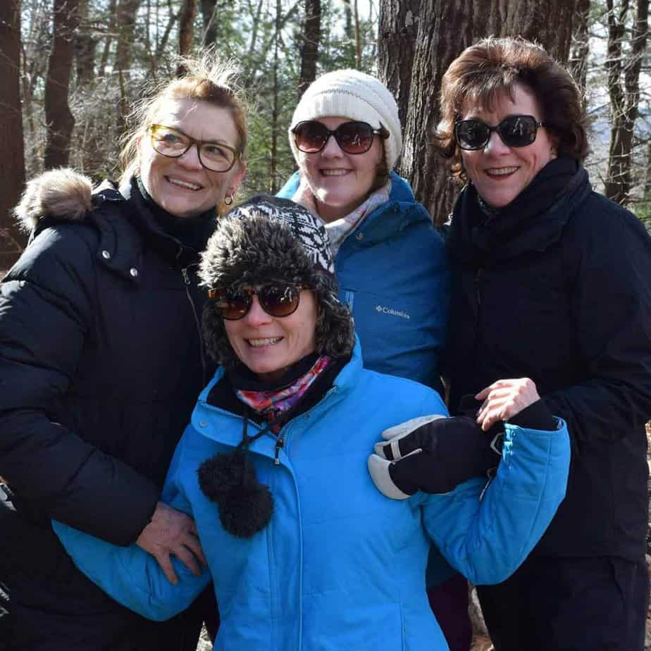 4 Women Smiling at Mountainside Treatment Center Awaken the Senses Alumni Camping Event in Canaan