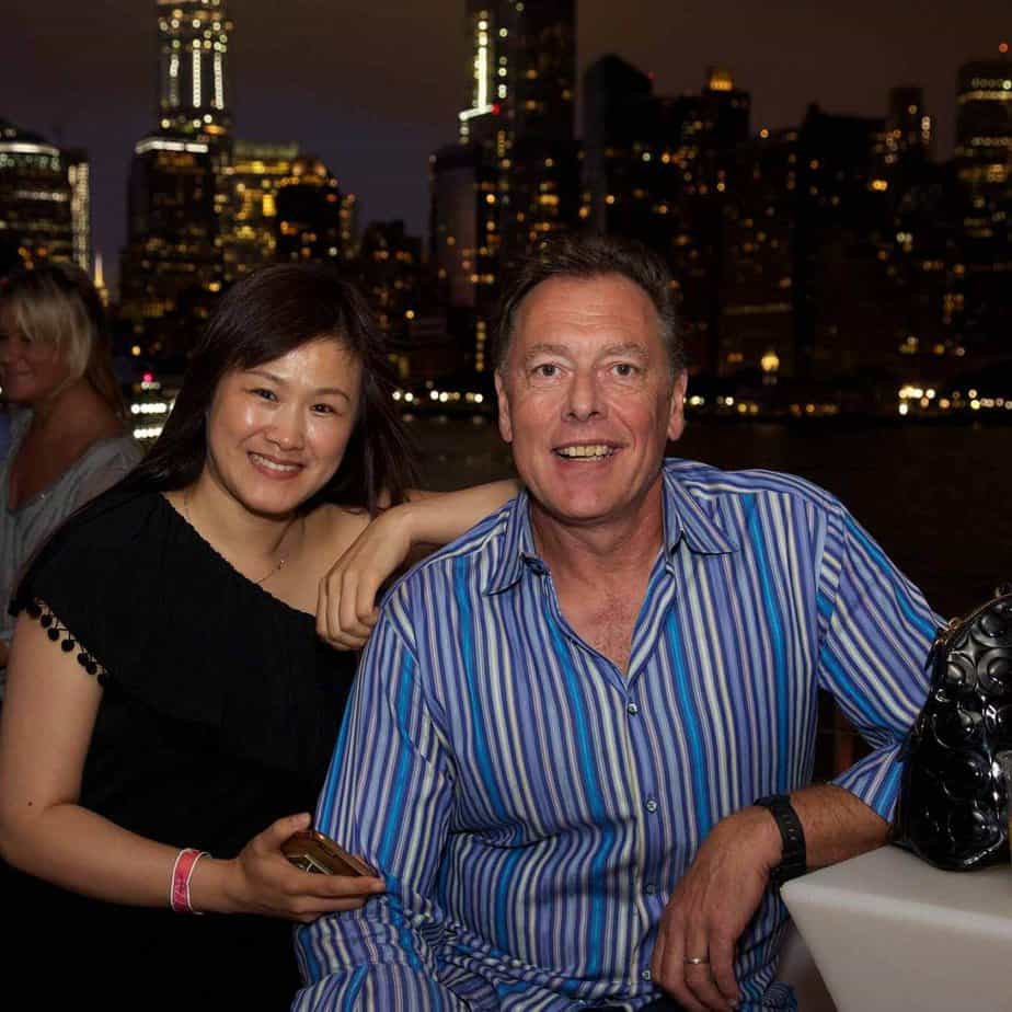 Man and woman by skyline at Mountainside Treatment Center Alumni Jazz on the Hudson Event in NYC