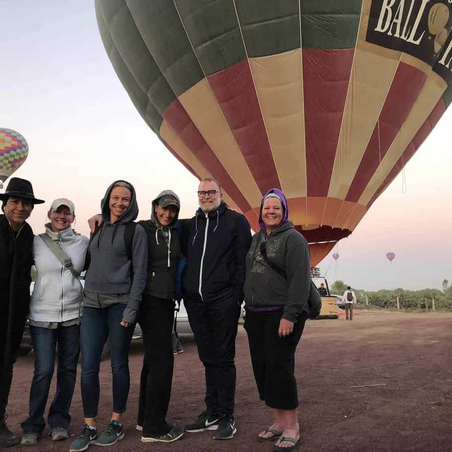 Group photo by hot air balloon at Mountainside Treatment Center Alumni Trip in Mexico City