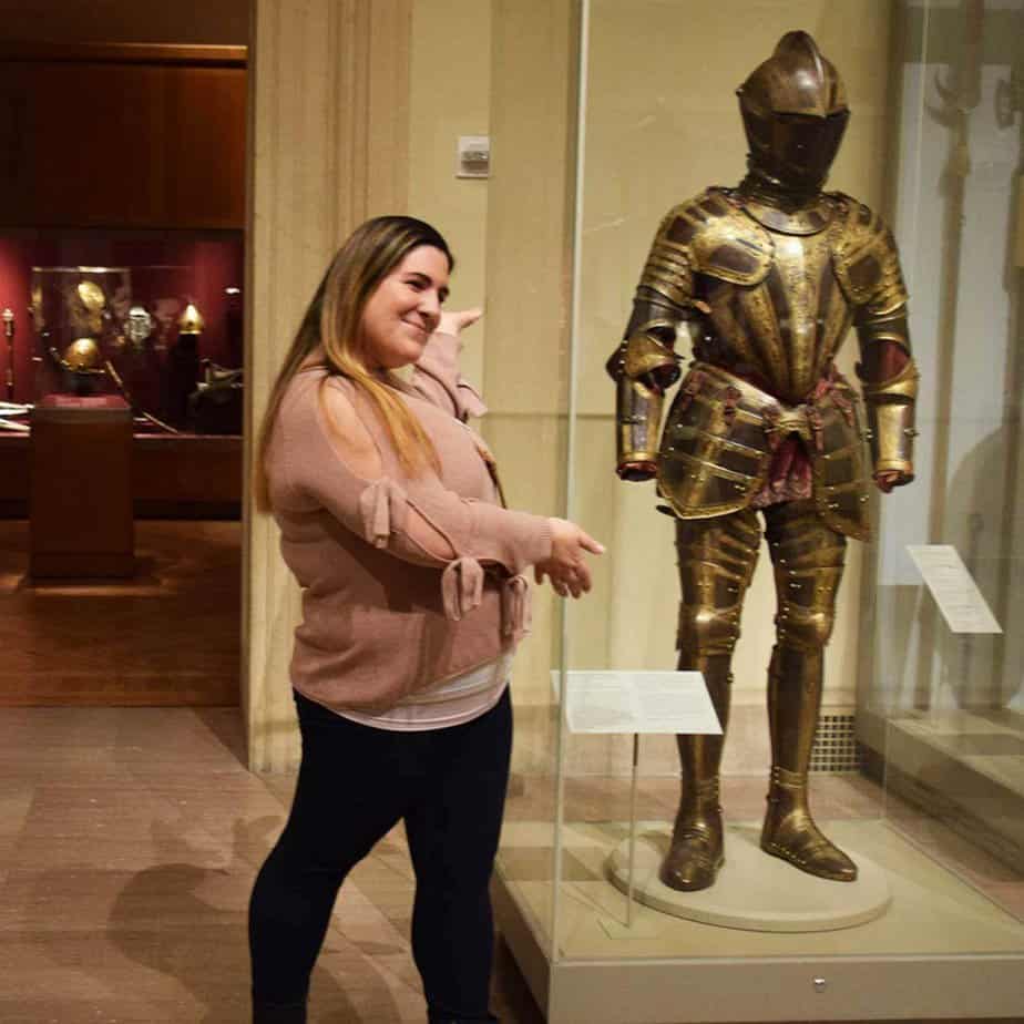 Woman posing by knight at Mountainside Treatment Center Alumni Met Museum Event in NYC