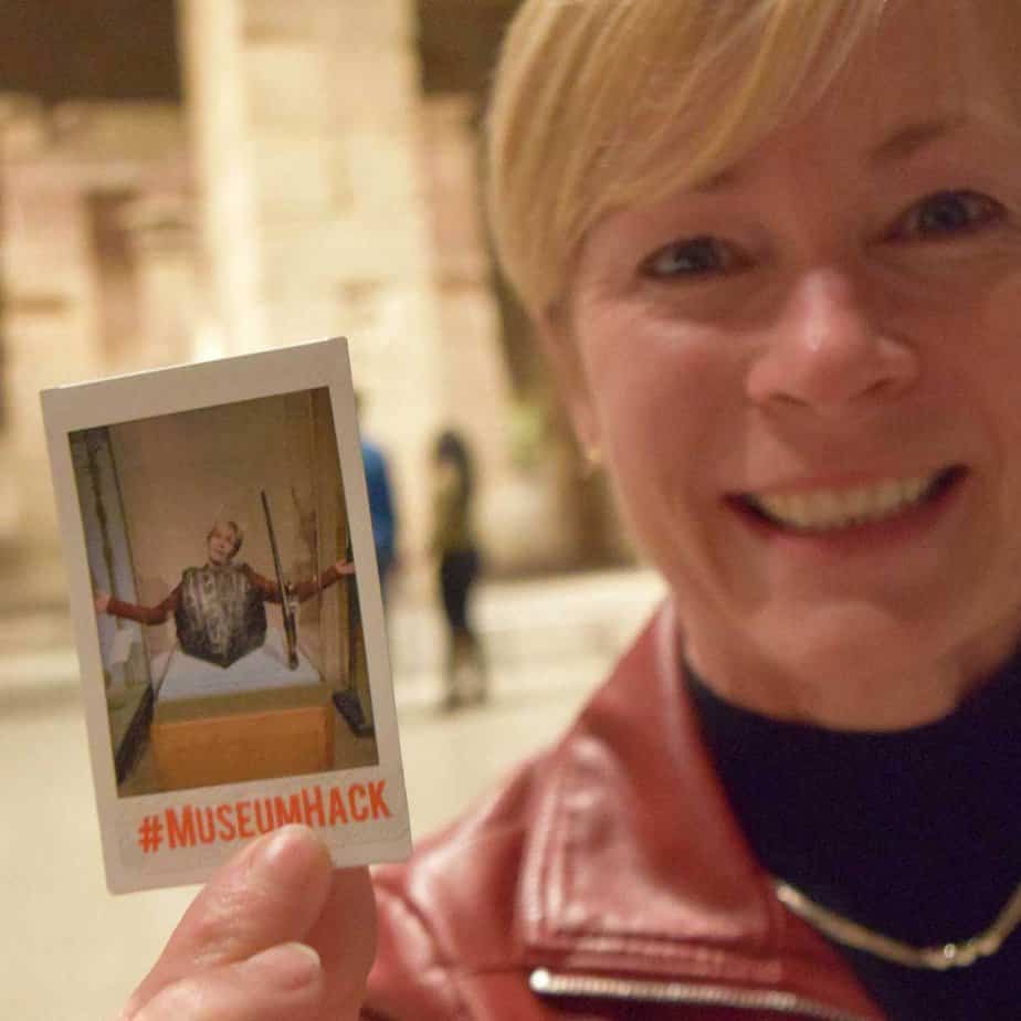 Woman holding a photo at Mountainside Treatment Center Alumni Met Museum Event in NYC