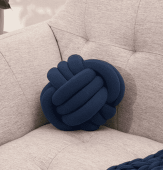 blue sensory pillow on couch