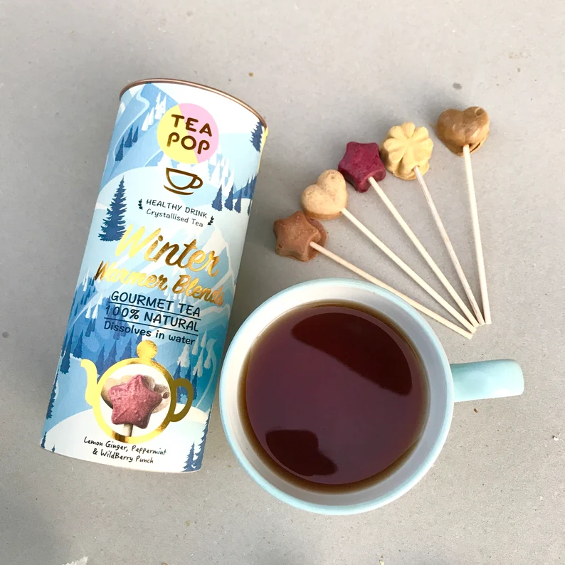 tea pops next to mug filled with coffee