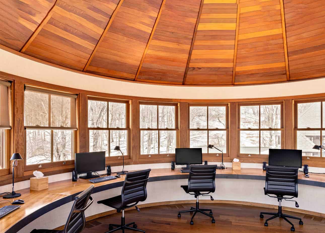 Computer room and working space with beautiful wooden ceilings at sober living home in Connecticut