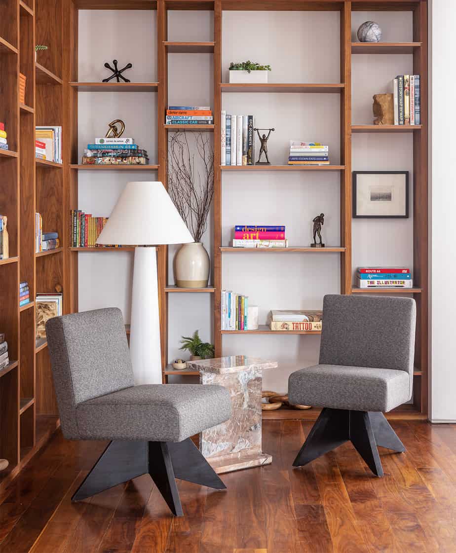 sitting and reading area and wooden bookshelf in sober living home