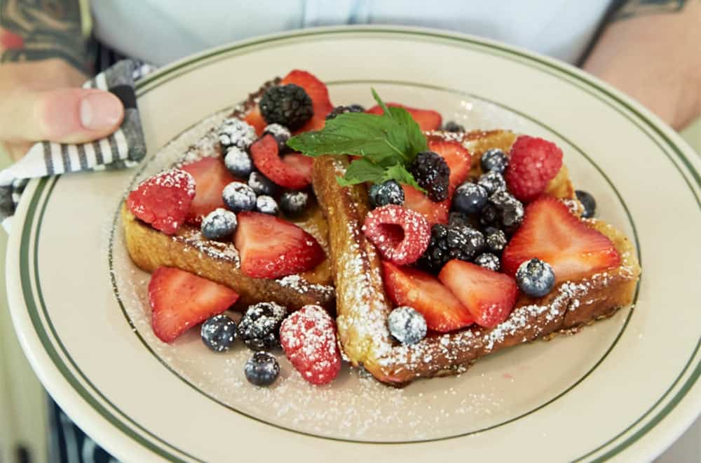 French toast with fruits and powdered sugar at Mountainside cafe in Connecticut.