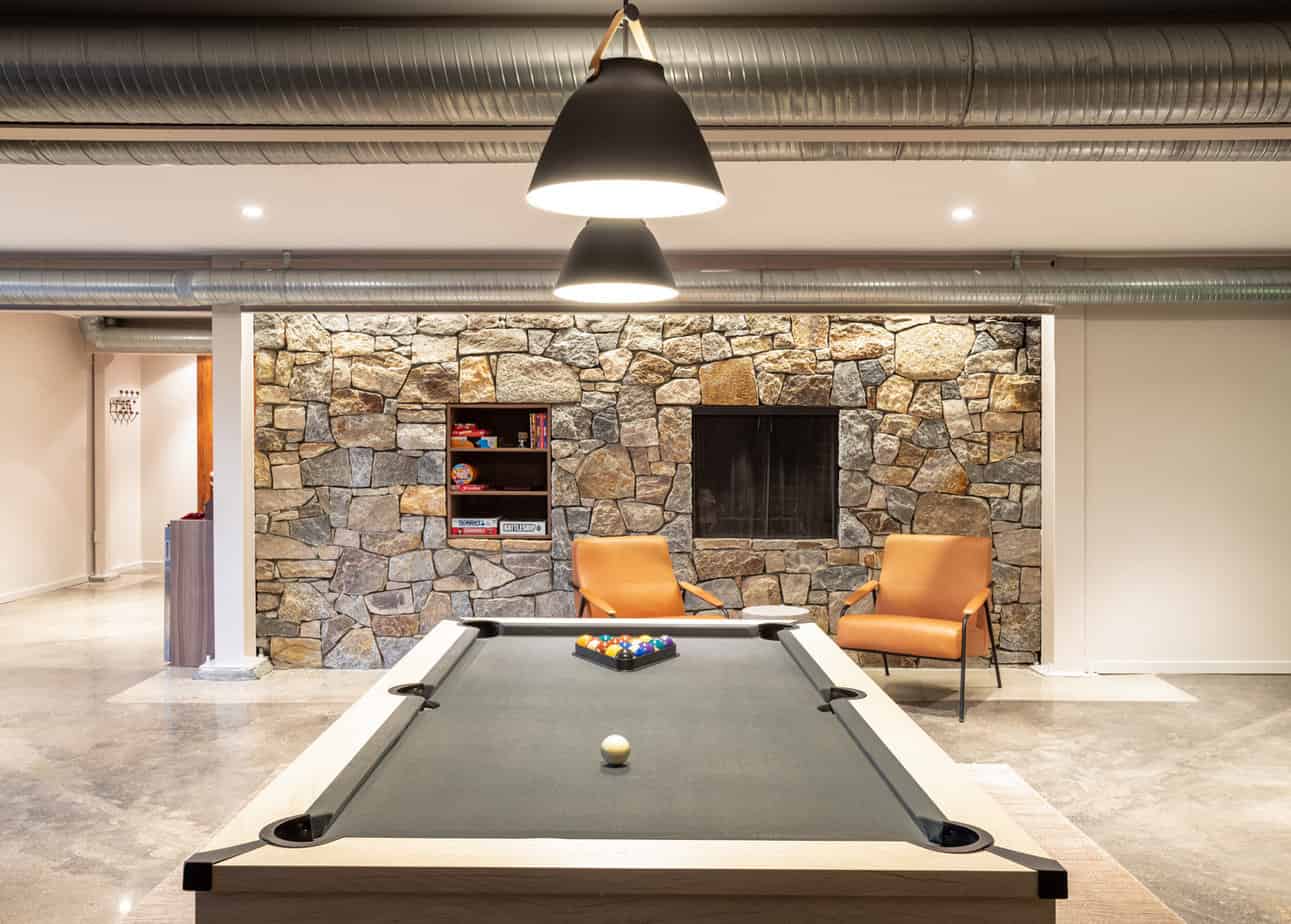 pool table in a rustic style game room at Mountainside's sober living home