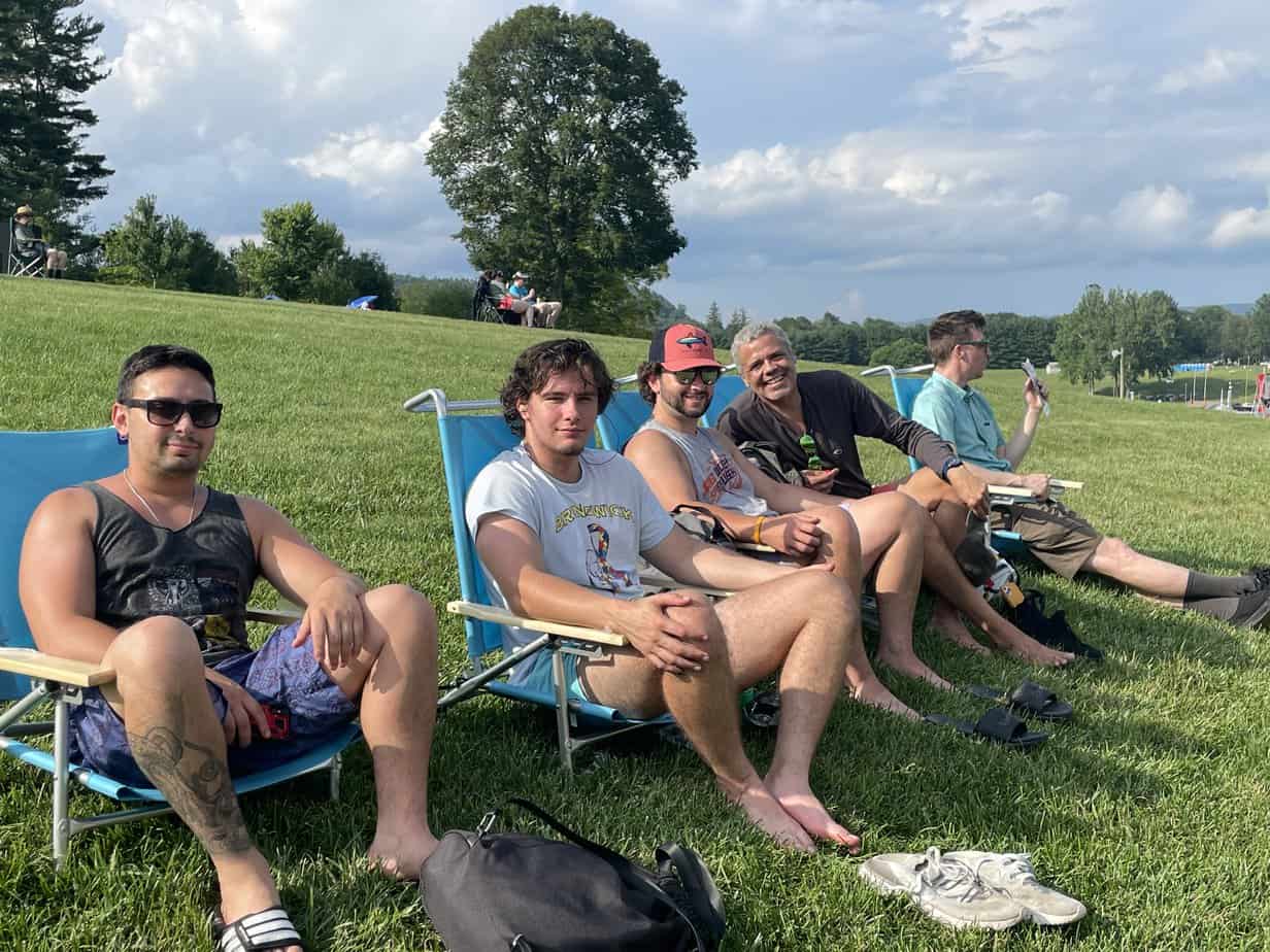 Group photo of men smiling in lawn chairs outside at Mountainside Treatment Center Extended Care Lime Rock Park Event Summer 2022