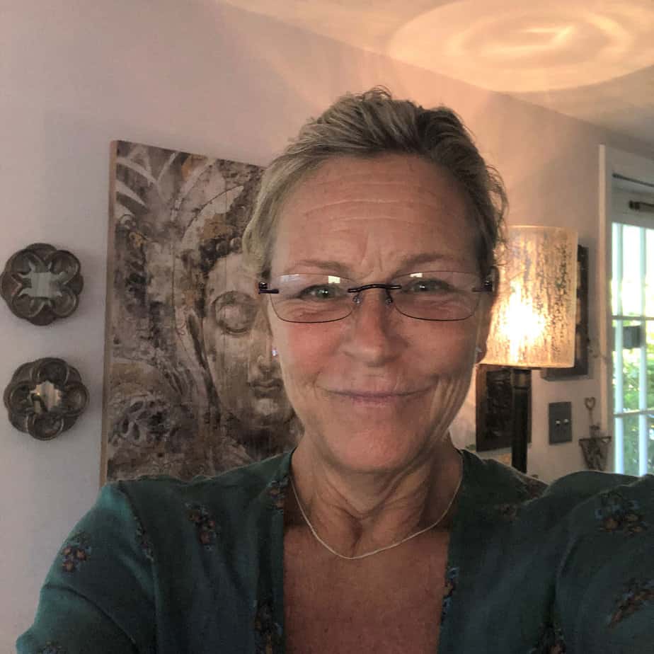woman in glasses takes selfie in living room