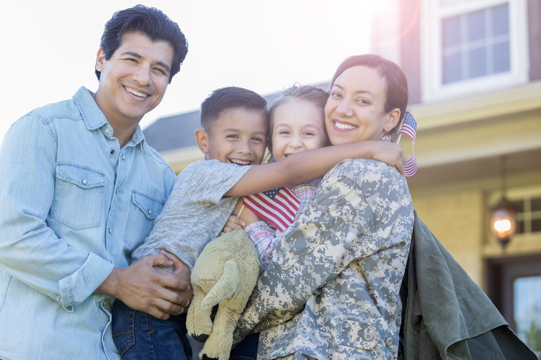 family of 4 supporting veteran woman in addiction recovery