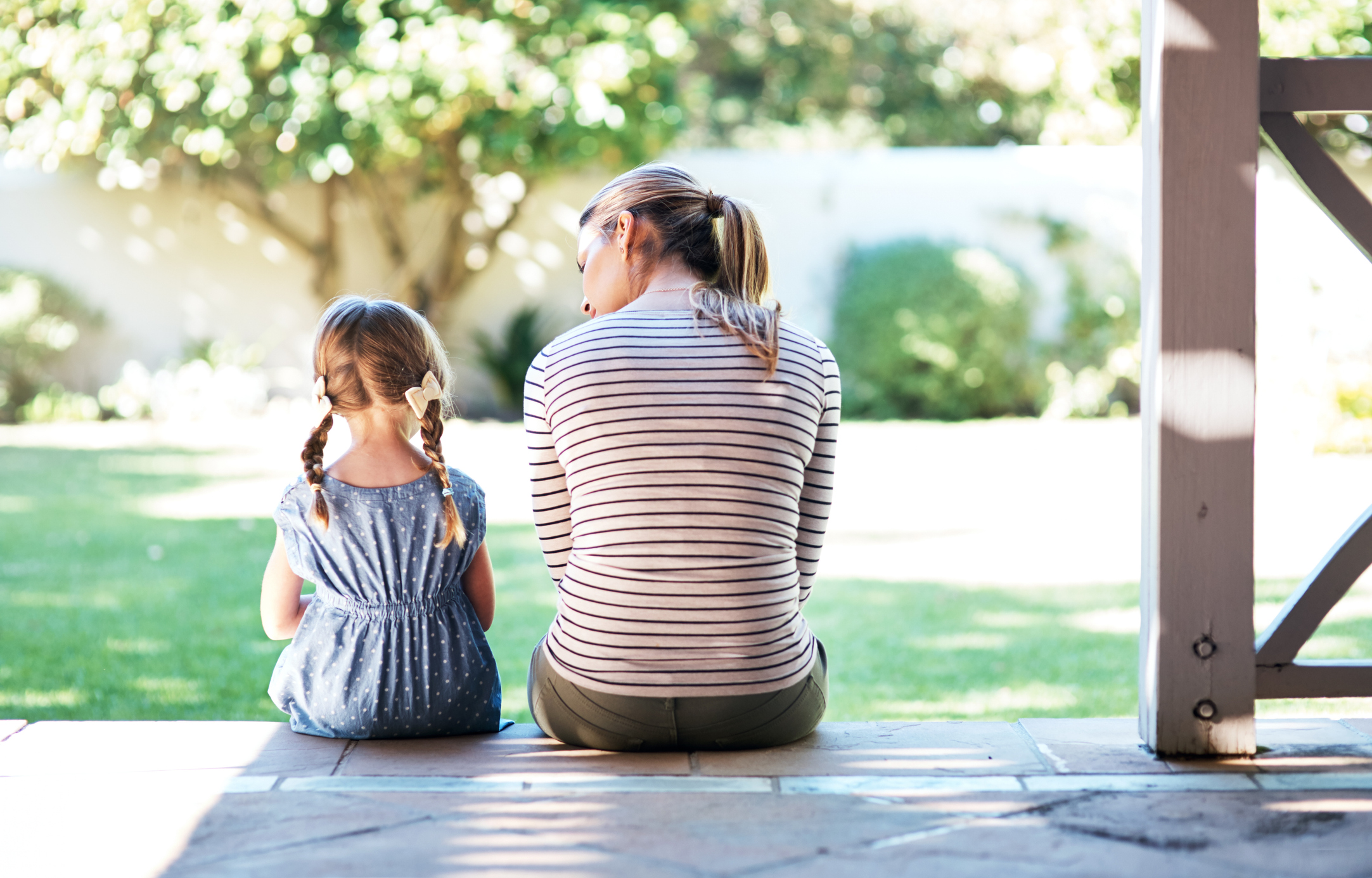 mom sitting next to child learn how to co-parent with addict loved one